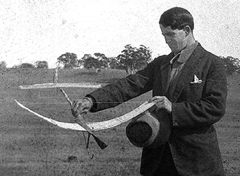 Reginald Duigan with a model aeroplane c.1908